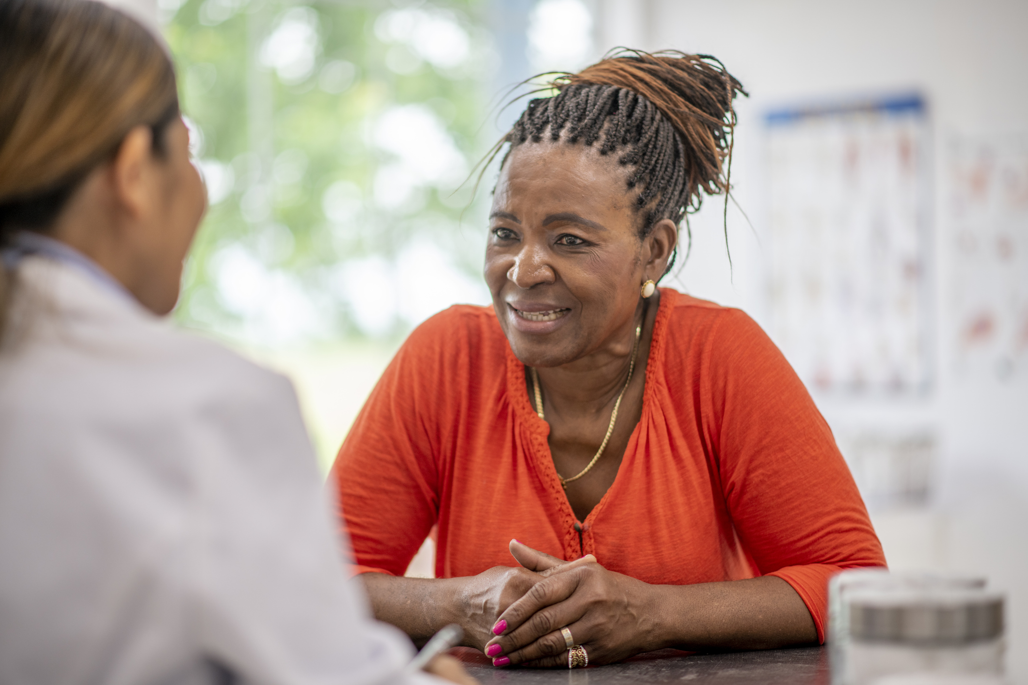 A person discussing long-term treatment with their care team